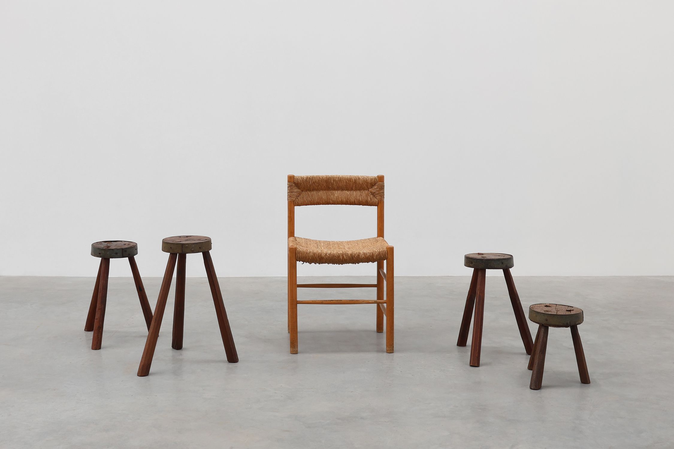 Brutalist French 1850s solid oak tripod stools with metal rim, set of 4thumbnail